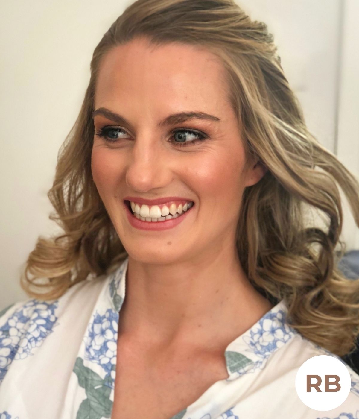 Bridal hair and makeup with soft waves and luminous, natural finish in Melbourne.