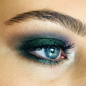 Close up of a green smokey eye makeup look by Rebecca Brown.